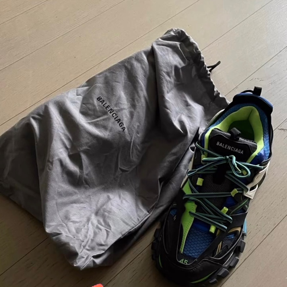 gently worn Balenciaga tracks.